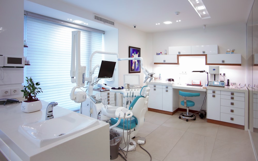 Location finder screen on mobile, clinic interior in soft focus